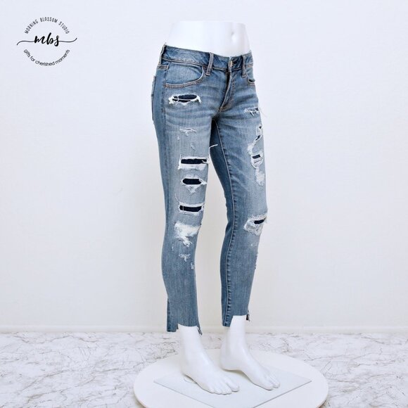 American Eagle Super Stretch Low Waist Distressed Raw Hem Jeggings - Picture 1 of 14